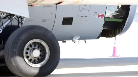 EPA China Eastern Airlines plane with a hole in an engine casing, Sydney airport (12 June)