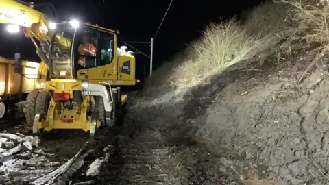 Network Rail engineers clearing landslide