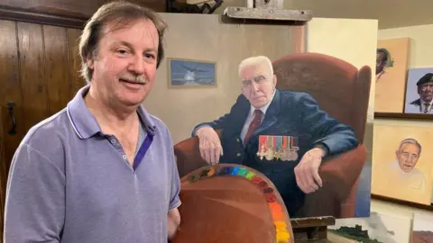 BBC Mr Russell with his painting of Mr Johnson