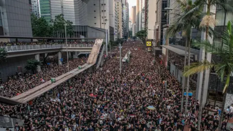 Getty Images Protesters at a pro-democracy and anti-Chinese government control mass demonstration in Hong Kong on 16 June, 2019