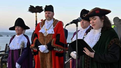 Erin Morgan dressed in the town crier robes