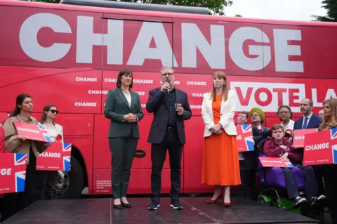 PA Media Sir Keir Starmer launched Labour's battle bus alongside shadow chancellor Rachel Reeves and deputy leader Angela Rayner