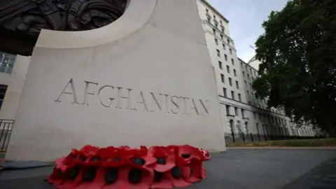 A monument inscribed with the word Afghanistan outside the headquarters of the Ministry of Defence in London