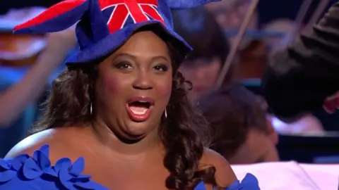 BBC Angel Blue performs at the Last Night of the Proms, wearing a Union Jack jester's hat