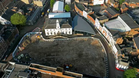 An aerial view of the market place in Leicester with the site cleared and fenced off