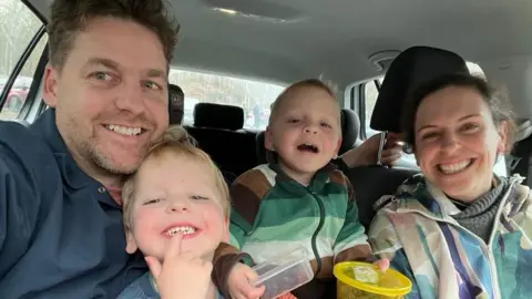 Contributed Oti with his family