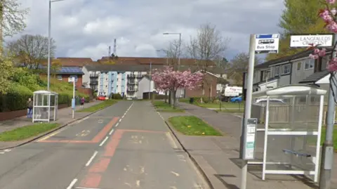 A google image on two bus stops on the opposite sides of Faifley Road with flats and houses on either side