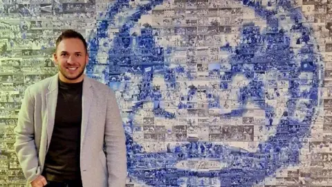 Nick Jackson Nick Jackson in front of a Posh poster