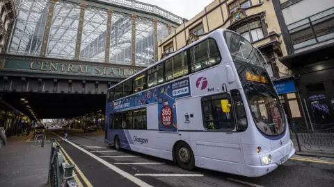 Getty Images A bus travels underneath the bridge at Glasgow Central train station