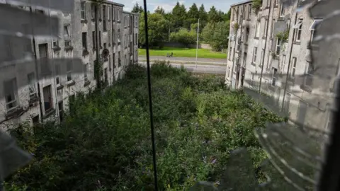 Getty Images A view of disused tenement properties on the Clune Park estate on August 2, 2019 in Port Glasgow, Scotland.