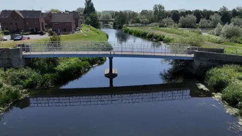 A footbridge over a river in the area