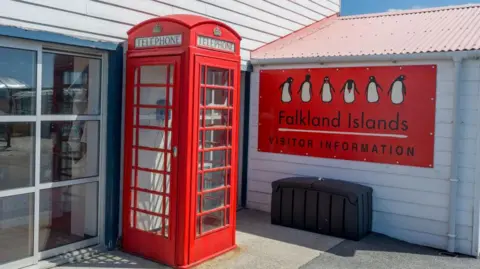 A classic British red phone box is pictured outside the Falkland Islands visitors centre in Port Stanley.