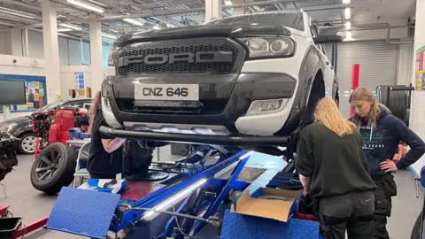 Women apprentice mechanics