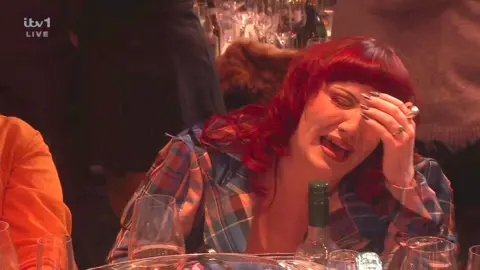 ITV CMAT reacts to losing a Brit Award. She had her head in her hands and cries fake tears.