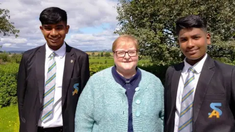 Cameron Brooks/Church of Scotland Somer and Areeb Umeed Bakhsh and Rev Linda Pollock