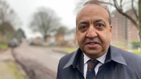 The Liberal Democrat Councillor for the Evington area of Leicester, Councillor Zuffar Haq is pictured at Hospital Close.  