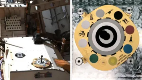 NASA The ceramic colour palette made in Stoke-on-Trent is seen on the Mars rover in the left-hand image, with a close-up of the palette is shown in the right-hand image. Ceramic circles of red, blue, green, yellow, black and white and two shades of grey have been mounted on to a gold-coloured plate.