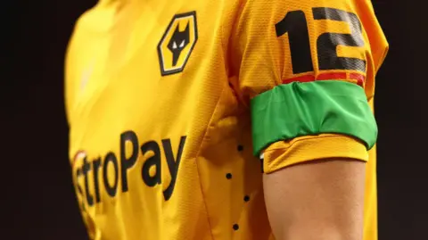 Wolves player wearing a green armband in 2023