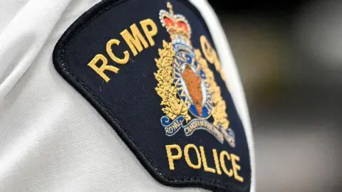 RCMP patch on person's uniform 