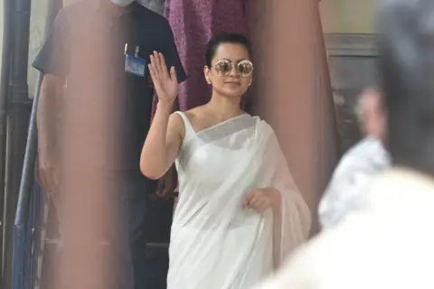 Getty Images Actor Kangana Ranaut arrives at Bandra police station to record her statement in a sedition case filed against her, on January 8, 2021 in Mumbai, India