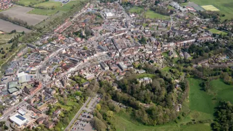 Getty Images An aerial view of Devizes in Wiltshire, with houses and trees.