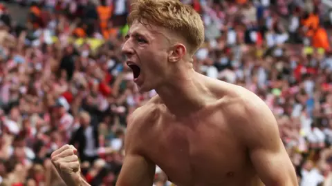 Tommy Watson celebrates scoring