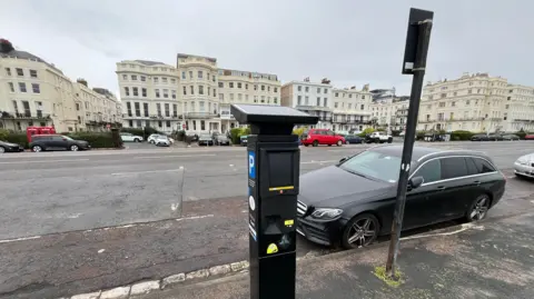 George Carden/ BBC One of the new touch screen parking machines on Brighton seafront with the A259 in the background