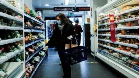 Getty Images A shopper in Sainsbury's