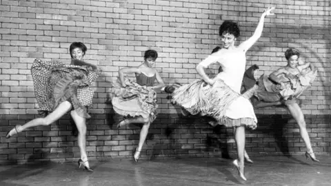 Getty Images Scene from the Broadway musical "West Side Story," L-R: Lynn Ross, unnamed actress, Chita Rivera, and Carmen Guitterez. Undated photo