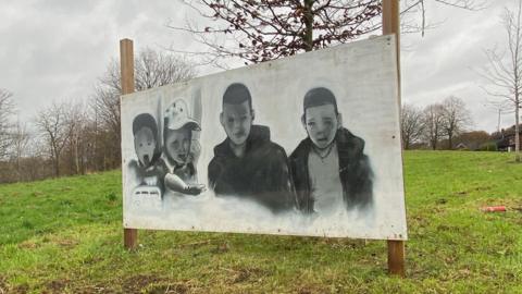A spray-painted picture of the Babbs Mill boys