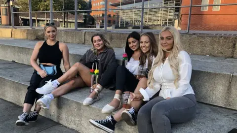 A group of young women drinking at Cardiff Bay