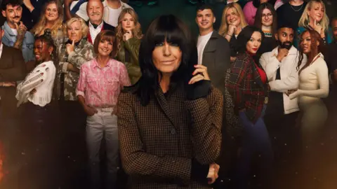 The Traitors host Claudia Winkleman standing in front of contestants