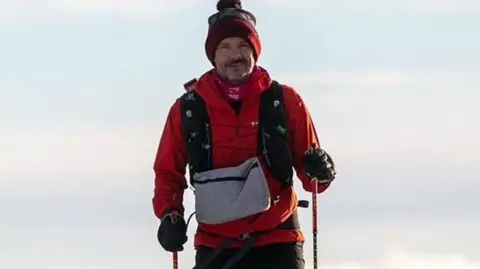 Cambridgeshire Police/PA Media Stephen Chamberlain in woolly hat and red anorak
