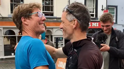 The Cumbrian22 Tim hugs Kirk at the finishing line