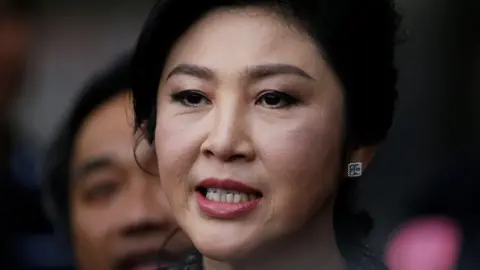 EPA Former Thai prime minister Yingluck Shinawatra speaks to the media as she arrives to deliver closing statements in her trial for alleged criminal negligence over her government's rice-pledging scheme at the Supreme Court's Criminal Division for Persons Holding Political Positions in Bangkok, Thailand, 1 August 2017.