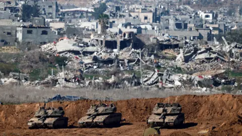 Reuters Israeli tanks near the border with Gaza, during a ceasefire with Hamas, as seen from Israel (21 January 2025)