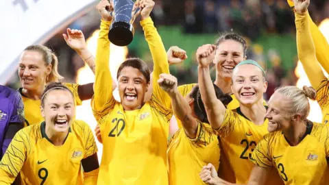 Getty Images The Matildas lift a trophy