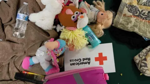 AFP Children's dolls and supplies lay on a cot at a Hurricane Florence evacuation shelter