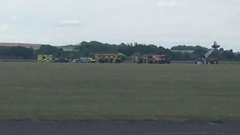 @grassydiagram57 Emergency service vehicles at site of plane accident in Duxford