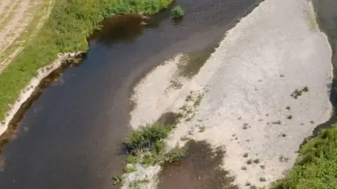 Natural Resources Wales An aerial shot of the river Severn, showing dried up parts of the embankment