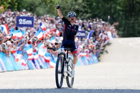 Getty Images Tom Pidcock punches the air