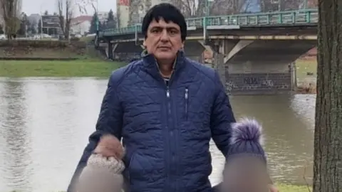BBC Mir Safi and two of his children in Ukraine