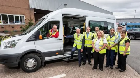 West Midlands Combined Authority Cllr Ian Ward, WMCA portfolio lead for transport, is pictured second from the left, meeting National Express West Midlands managing director David Bradford (third from the left) and members of the National Express Accessible Transport team