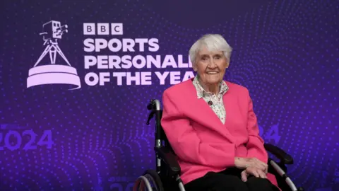 Jean Paton wearing a pink jacket