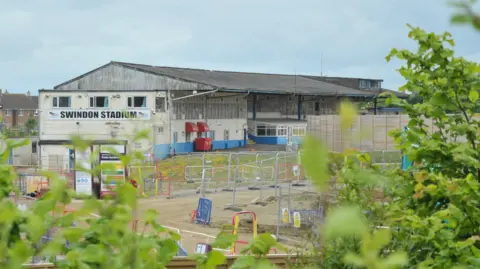 LDRS Construction site outside Abbey Stadium. Metal fences can be seen.