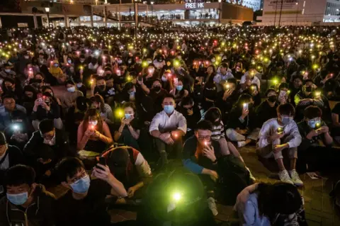 Getty Images Demonstrators shine lights from smartphones during a rally at Edinburgh Place in the Central district of Hong Kong, China, on Thursday, Nov. 14, 2019.