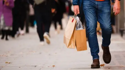 Getty Images Man shopping on Oxford Street