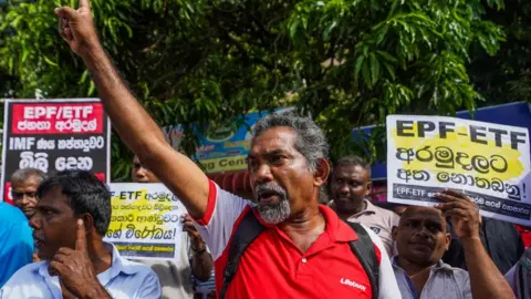 Getty Images Protesters chant slogans during the protest on July 12, 2023, in Colombo, Sri Lanka. The Inter-company Employee Union held a protest in front of the Labour Department. This protest was held, asking not to touch the Employees' Trust Fund and Employees Provident Fund.