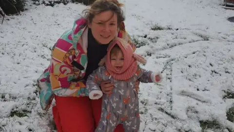 Carys Marshall Baby India and her mum Carys in the snow
