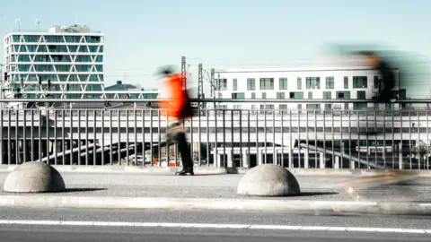 Getty Images A man walking in Berlin